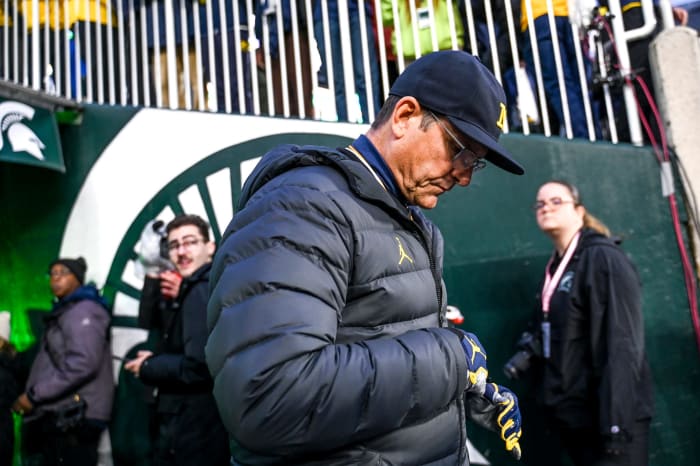 Michigan head coach Jim Harbaugh walks onto the field before the game against Michigan State on Saturday, Oct. 21, 2023, at Spartan Stadium in East Lansing.